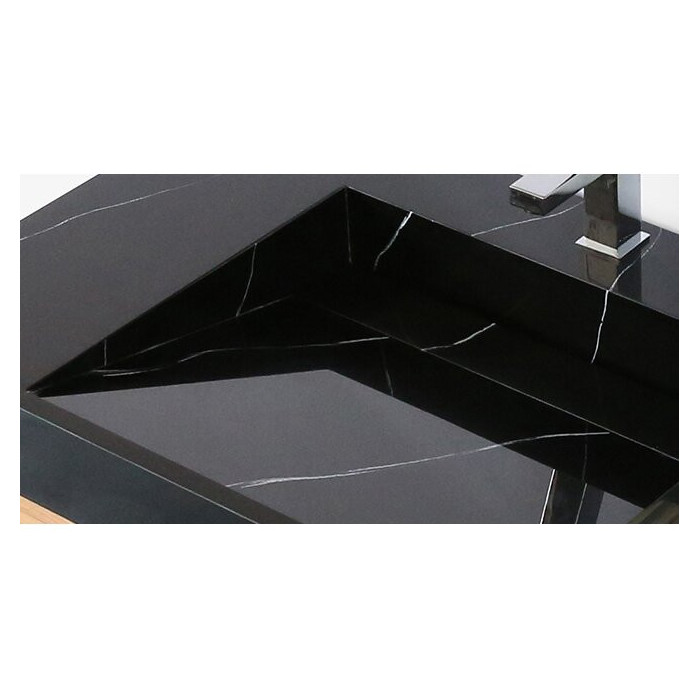 The sink is mounted on the VITRAZ furniture, 914 x 559 mm, black marble.